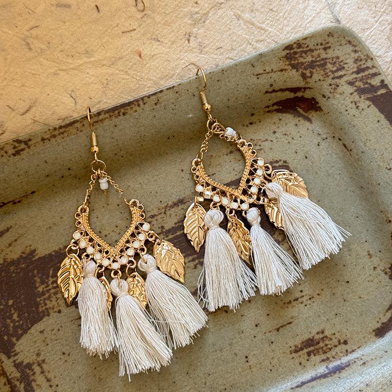 

Retro Ethnic Bell Tassel Earrings: Exquisite, Fashionable Dangle Design with Light Luxury Appeal.