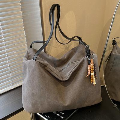 Eine lässige und elegante Tragetasche mit großem Fassungsvermögen, eine einfache Umhängetasche für den Arbeitsweg von Frauen