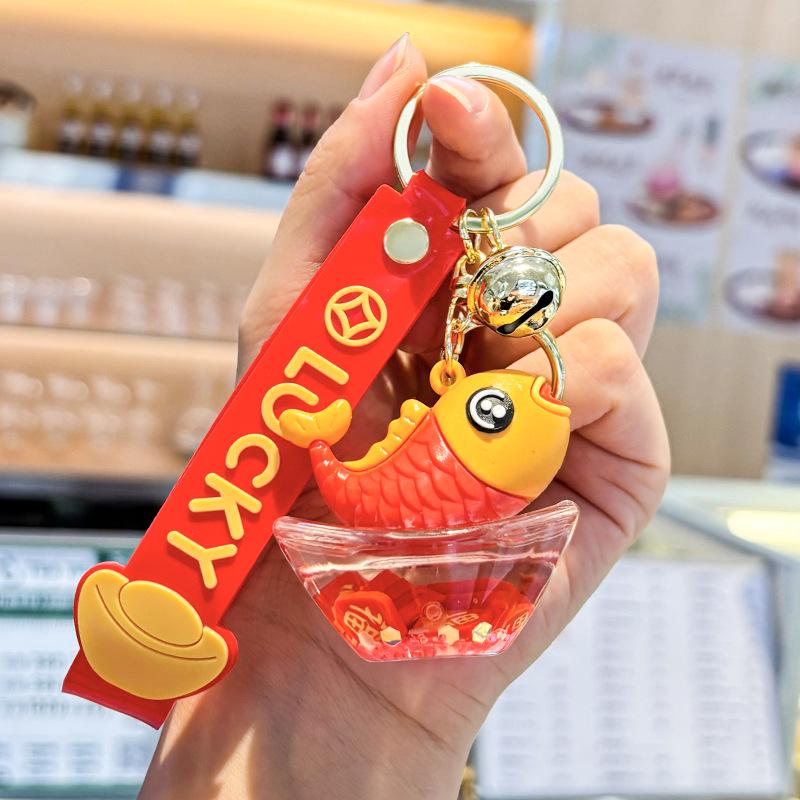 Akrylový přívěsek na klíče s tekutým pískem a obsahem oleje - Perfektní malý dárek na tašku nebo do auta.