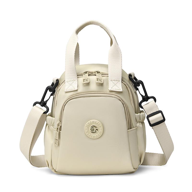 Kompakt Nylon Crossbody Miniryggsäck med Topphandtag Casual Liten Dagryggsäcksväska för Kvinnor Daglig Resa