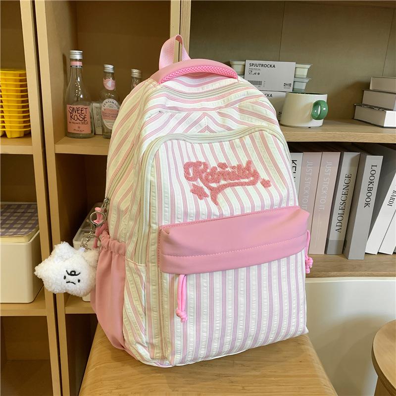 New high-value, fresh and sweet candy-colored striped backpack, high school student large-capacity backpack.