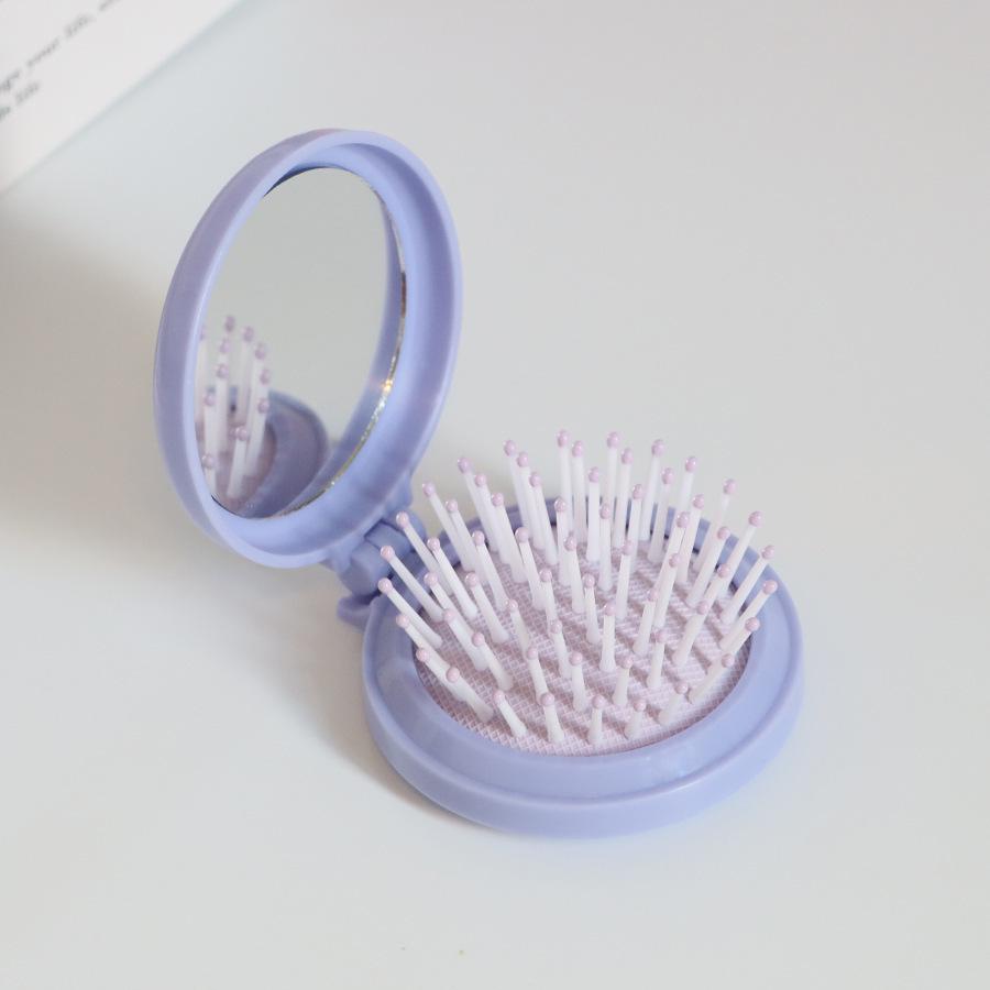 Kompakter Klappkamm & Schminkspiegel mit Airbag-Polster für Kopfmassage