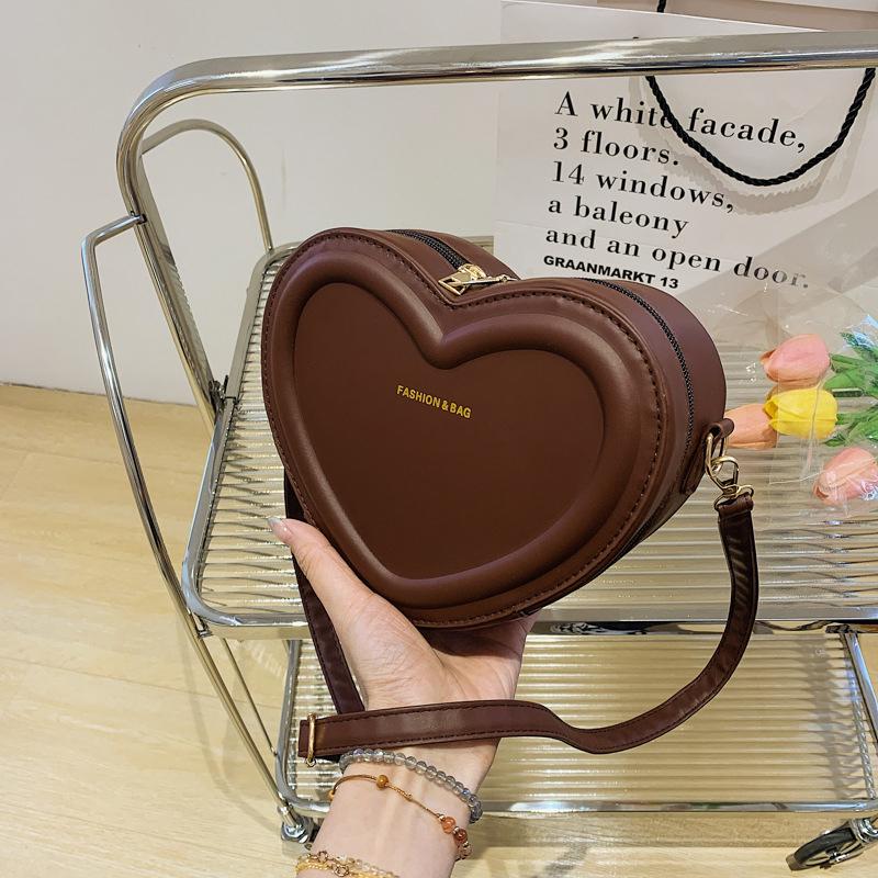 Modische Umhängetaschen in Herzform für Damen Neue einfarbige PU-Leder-Umhängetasche Lässige Damen-Handtaschen Designer-Taschen Qualität