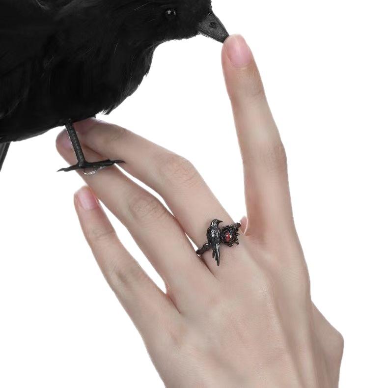 Gothic Metal Ring with Intricate Crow Design and Red Gemstone