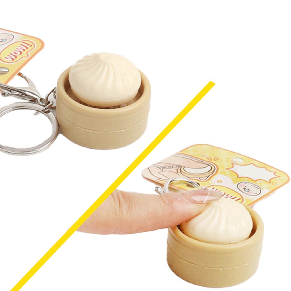 Niedlicher Schlüsselanhänger mit simuliertem gedämpftem Brötchen und Knopf-Dekompressionfunktion, Kreatives Geschenk