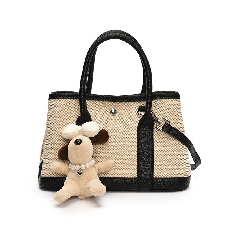 Spring new fashion contrasting color splicing portable bucket bag women's leisure work commuter wind messenger letter bag