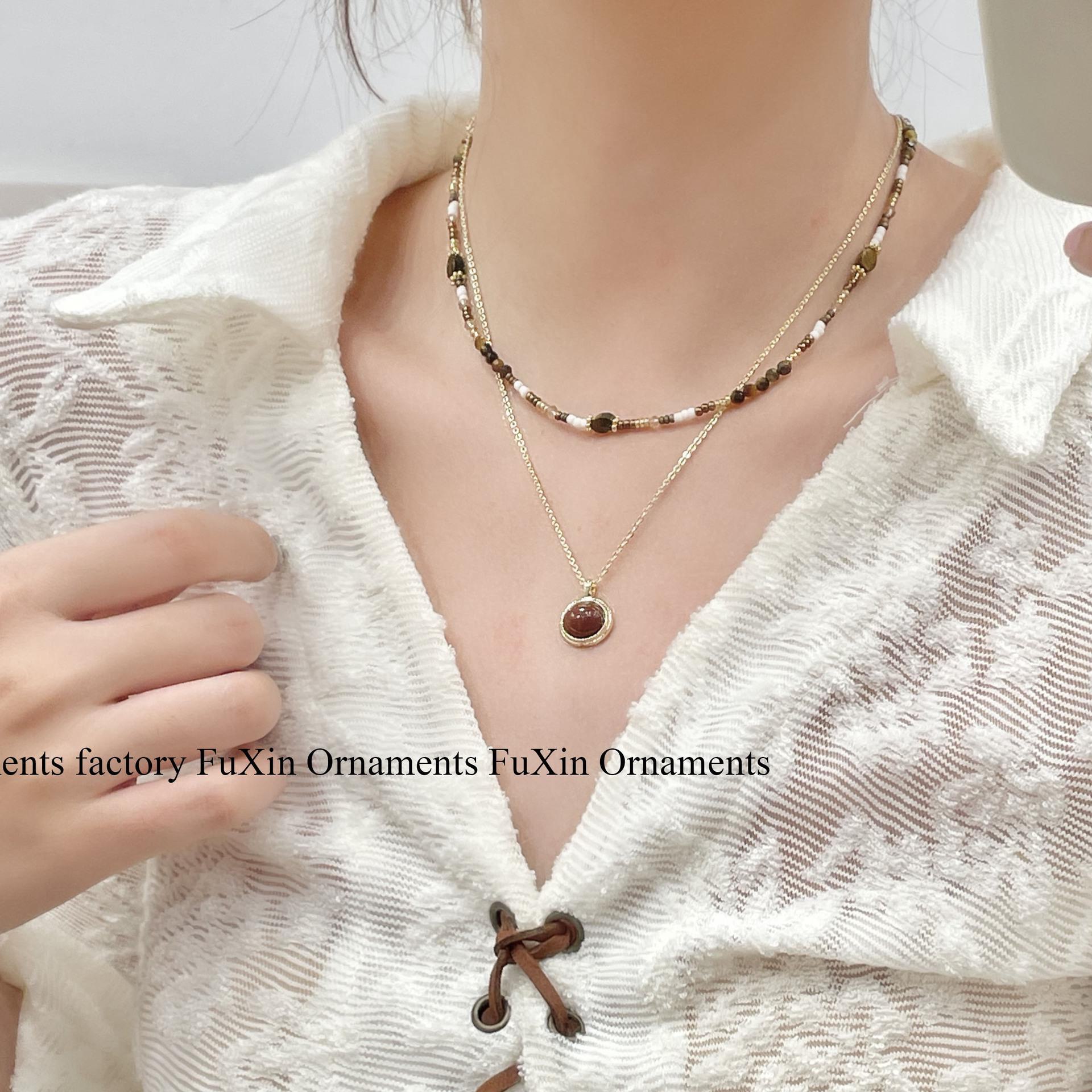 

Двухслойное ожерелье Suzyacc Maillard с бусинами и камнем тигровый глаз Flat Oval Gold Sandstone Maillard Necklace