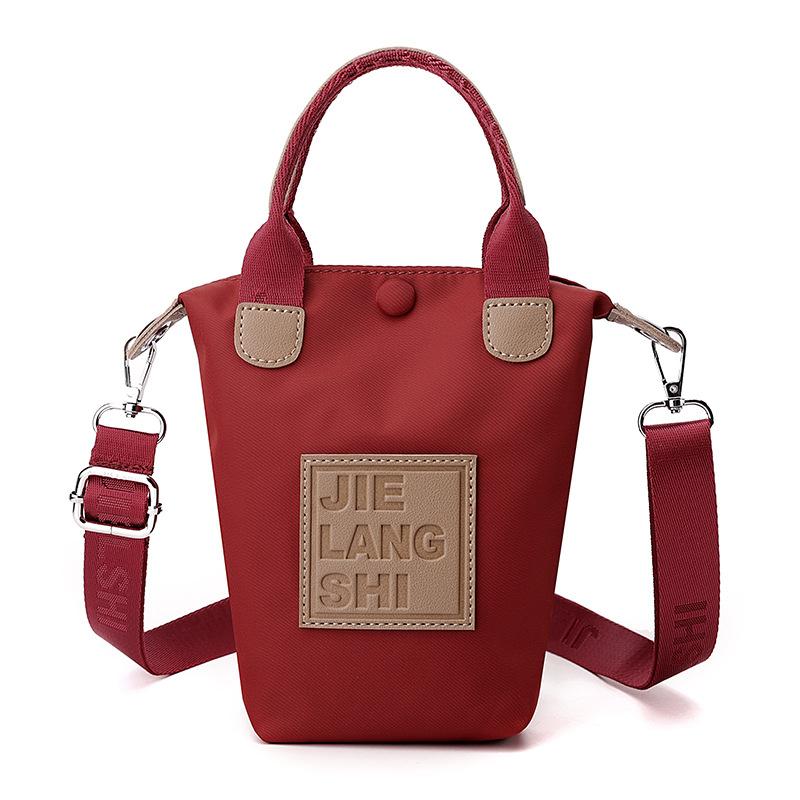 

Женская сумка, Новая ткань Оксфорд, Повседневная сумка для мобильного телефона, Текстурированная нейлоновая мини-сумка-ведро 10*5*20cm