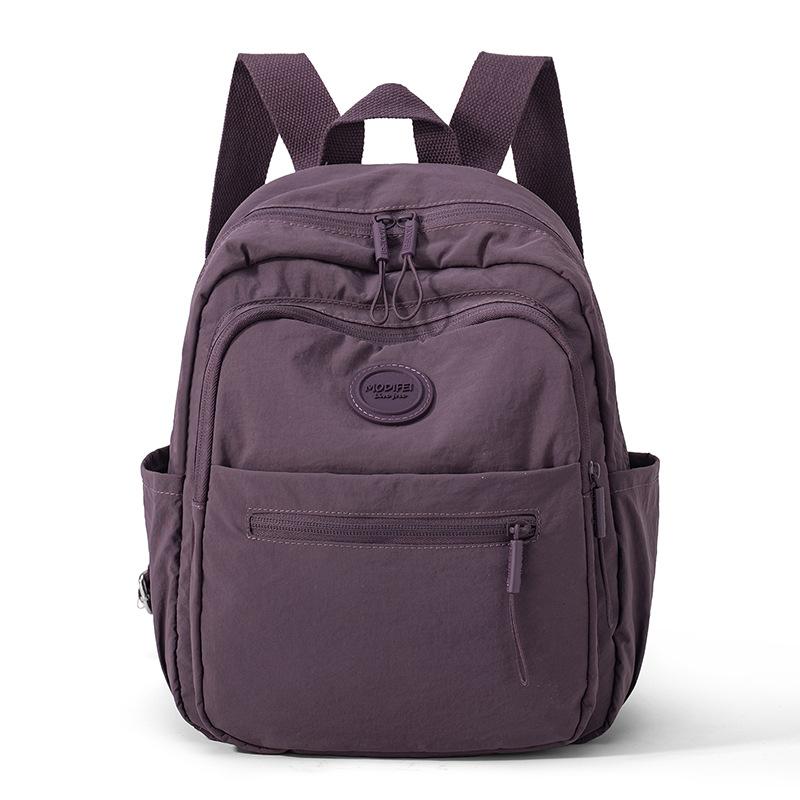 

Нейлоновый рюкзак Женский рюкзак большой вместимости Легкая дорожная сумка темно-фиолетового