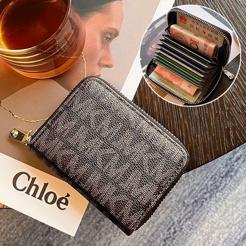 

Жіночий гаманець-акордеон проти крадіжок та антимагнітний з численними відділеннями для карток