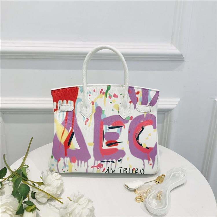2021 New platinum bag first layer cowhide painted spray painting graffiti bag portable shoulder messenger bag personalized women's bag tide