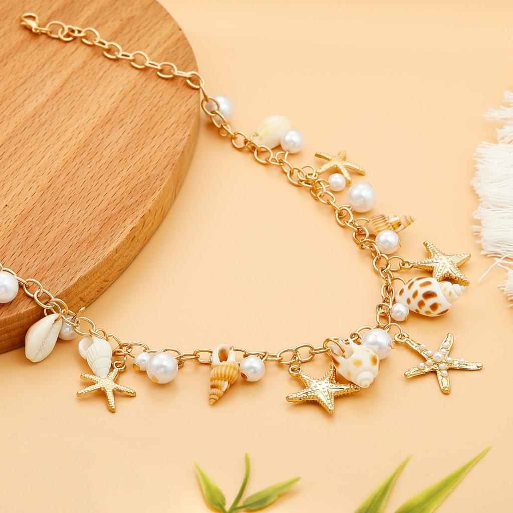 Single-piece beach seashell waist chain, faux pearl, starfish, and conch jewelry, a stylish accessory for beach vacations and pa