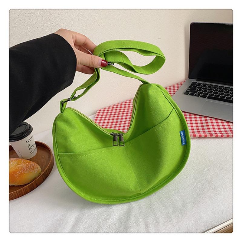 

Large capacity canvas bag women s new casual shoulder dumpling bag student class commuting messenger bag
