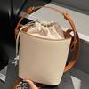 Niche design contrasting color portable bucket bag women's 2025 new casual retro handbag Korean version shoulder messenger bag