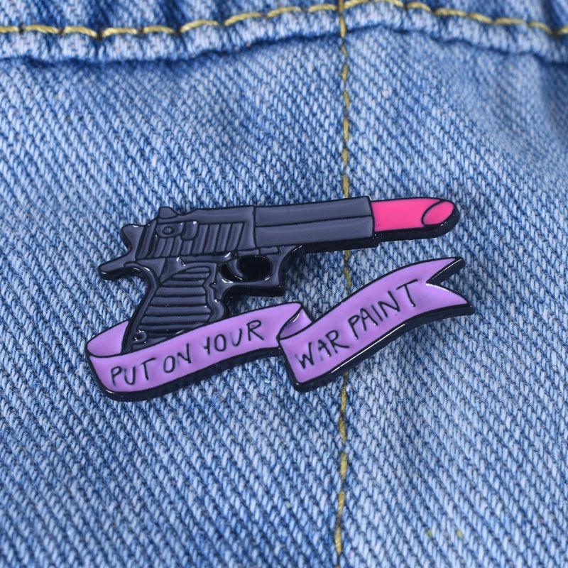 European and American Creative Pink Pistol Lipstick Brooch with Ribbon - PUT ON YOUR WAR PAINT серый