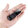 0,66" Mini Flip Mobiltelefon Minste klapptelefon FM Trådløs Bluetooth 3.0 Oppringer Handsfree Øretelefon Enkelt SIM-kort telefon
