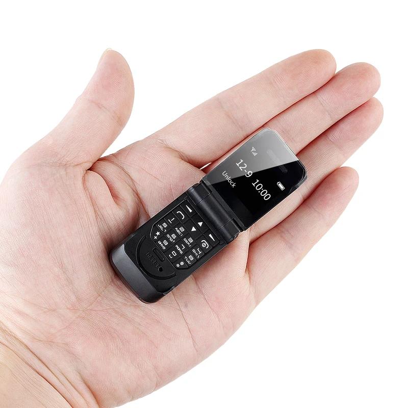 0,66" Mini Flip Mobiltelefon Minste klapptelefon FM Trådløs Bluetooth 3.0 Oppringer Handsfree Øretelefon Enkelt SIM-kort telefon