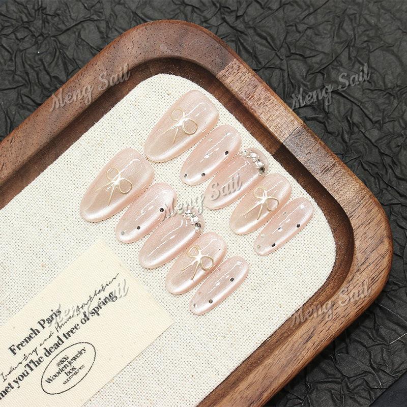 Magic Mirror Bow: Handmade Pink Cat Eye Nail Art with Sweet Heart Design