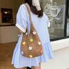Beautiful flower hollow woven solid color tote bag, new large-capacity shoulder underarm bag, light and versatile bag