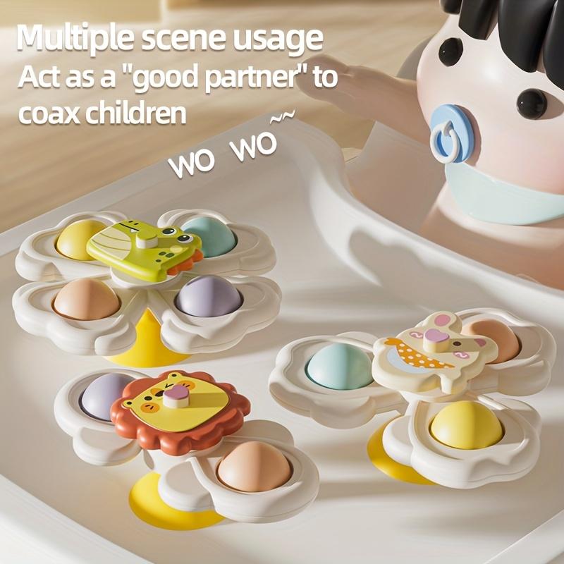 A Set of Three Cartoon Animal Suction Cup Spinning Tops for Babies, Designed To Enhance Hand-Eye Coordination During Early Education