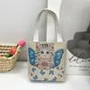 Stile etnico femminile da turismo ricamo elefante piccola borsa a mano fiore intrecciato borsa a tracolla in tela borsa per studenti quattro stagioni