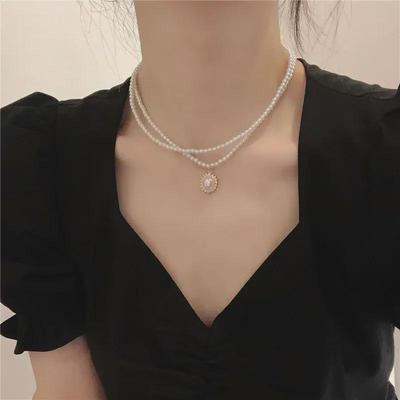 Elegante doppellagige französische Perlenkette - Trendiger Retro-Schlüsselbeinstil für Damen, High-End Luxus-Nischendesign