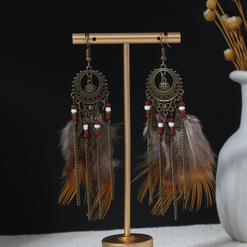 Retro ethnic style woven feathers long fringed earrings, bohemian high-end hollow rice bead earrings