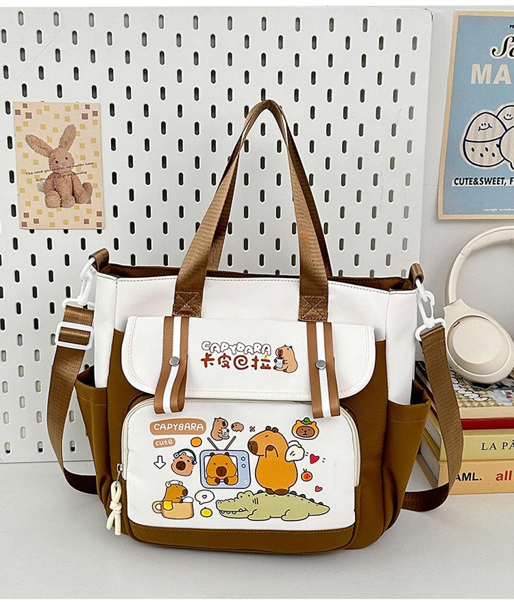 School bag 2025 new large-capacity cartoon multi-compartment high-value school bag Korean version commuting simple make-up bag lightweight backpack