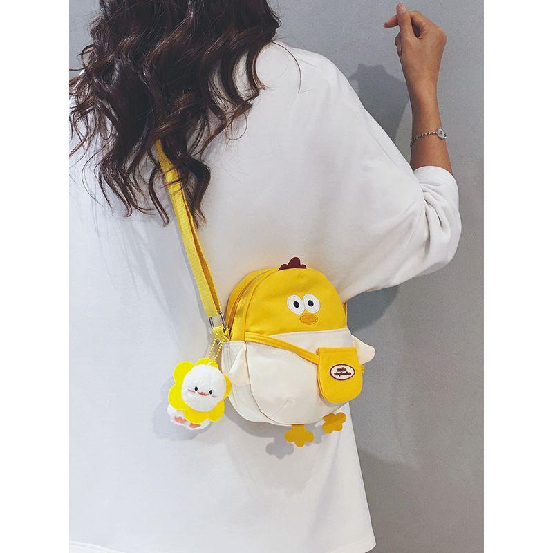 

Милая мини-холщовая сумка женская 2025 Осень Новое поступление Повседневный нишевый стиль Сумка для мобильного телефона Детская мультяшная сумка-мессенджер White with yellow [with pendant]]
