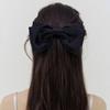 rosy silky black ribbon pin