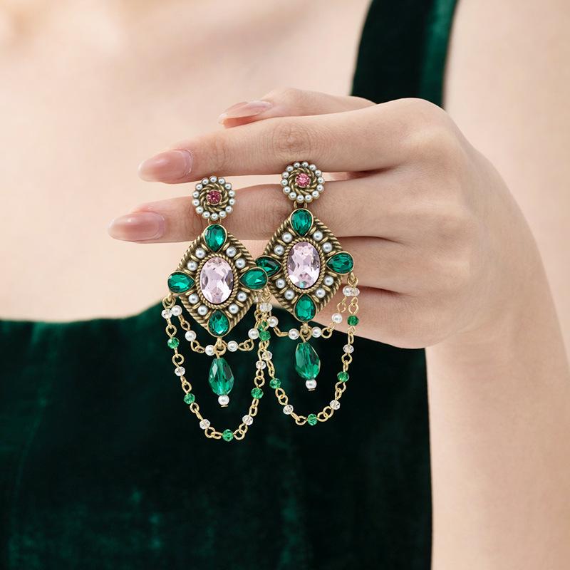 

Elegant Geometric Rhombus Tassel Earrings with Crystal Gemstones, Beaded Chains, and Silver Studs.