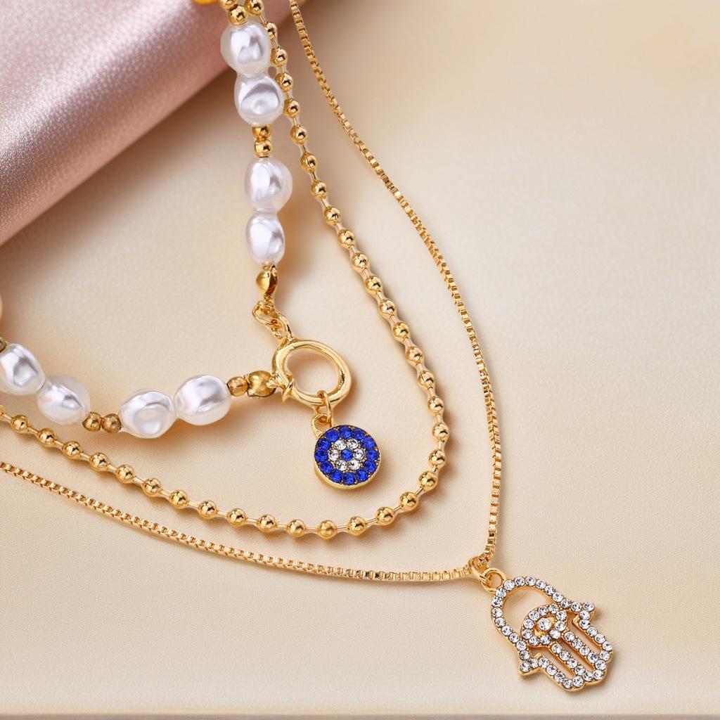 Vintage Geometrische Anhänger Halskette für Damen Glückliche Böse Augen Handfläche Kreuz Perle Zirkon Mehrschichtige Metallkette Choker Schmuck
