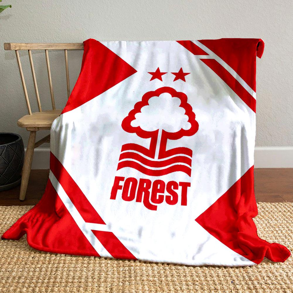 A red tree and wave logo with two stars, framed by geometric red shapes. for all seasons blanket lunch break throw gift