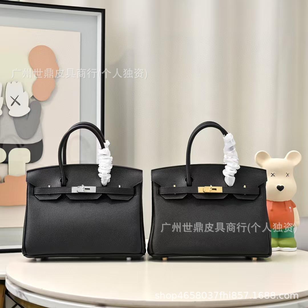 

Guangzhou foreign trade physical LOGO new togo first layer cowhide lychee pattern platinum bag large capacity portable women s bag Small size: 25*19*10