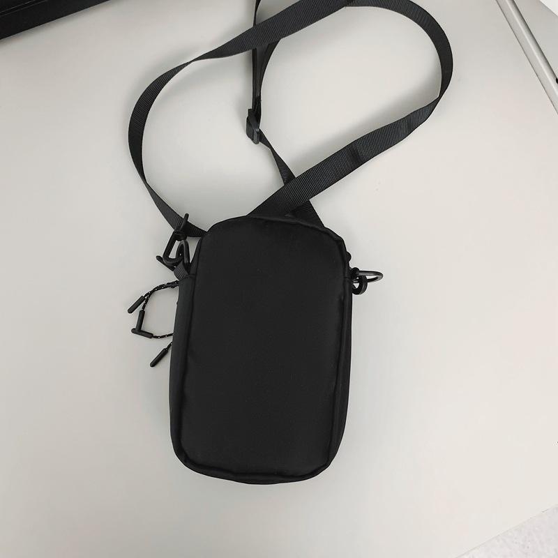 Mobile phone bag female messenger 2025 new mini small bag canvas bag fashion casual vertical shoulder key change