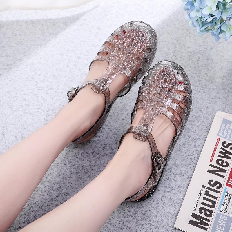 Baotou sandals women's transparent solid color hole shoes spring and summer new casual outer wear hollow breathable flat sandals