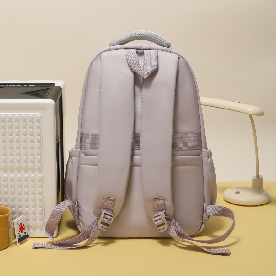 Zaino zaino scolastico giapponese stile college femminile grande capacità dolce carino zaino puro studenti medie e superiori zaino multi-scomparto