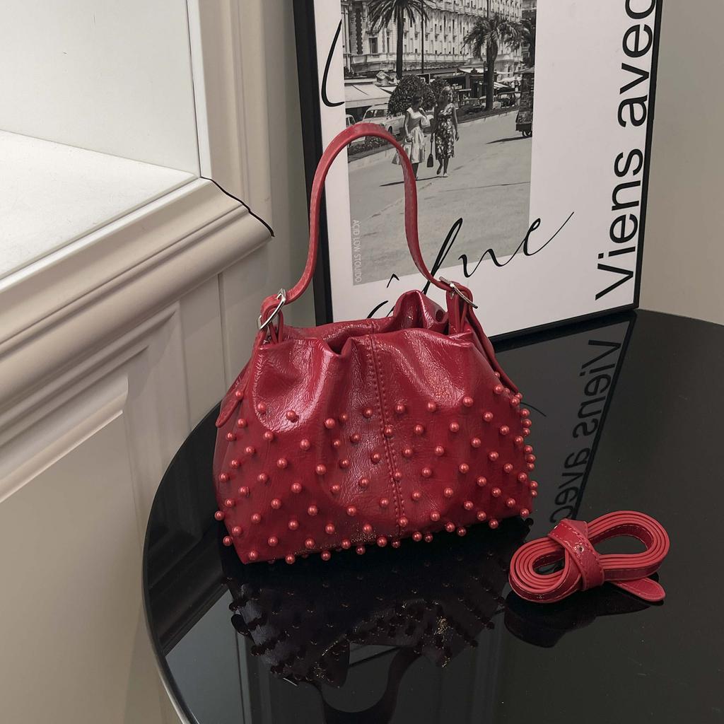 Trend European and American fashion rivets spring and summer armpit women's bags simple and versatile portable bucket bags single shoulder oblique spa