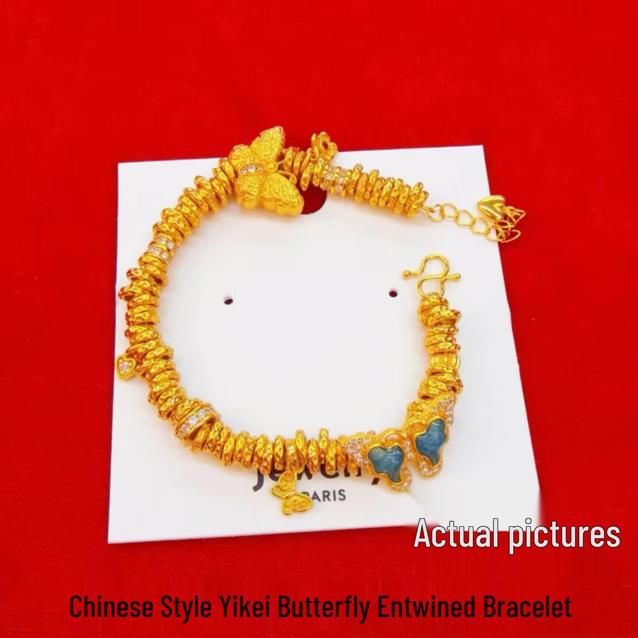 Золотой браслет-бабочка с синими акцентами и бриллиантовыми деталями