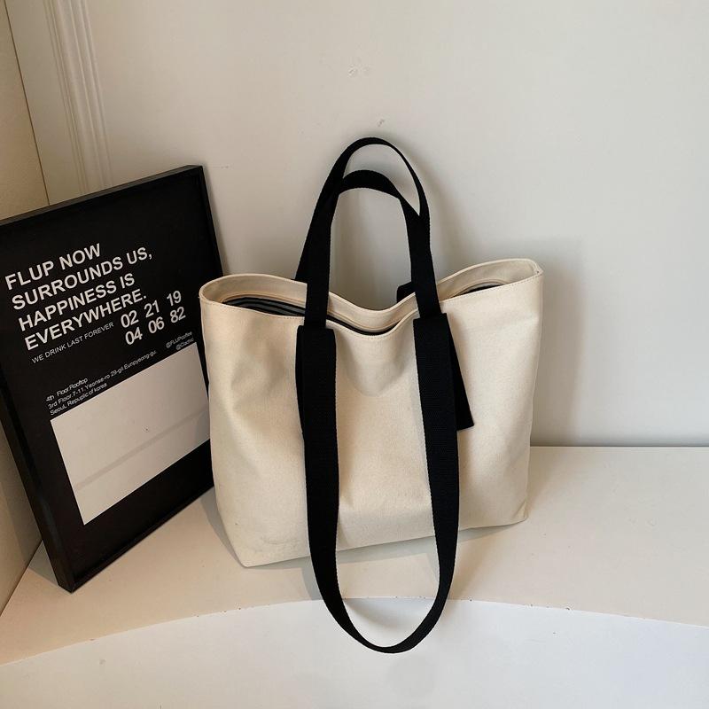 2025 summer new fashion simple solid color portable tote bag lazy wind commuting large capacity shoulder canvas bag