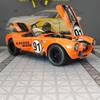 CDKM1 1:22 simulation Ford Cobra convertible sports car alloy model car ornament, door can be opened, steering shock absorber