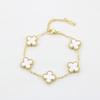 Bracciale da donna a fascia con conchiglia double-face e quadrifoglio, resistente ai colori, alla moda e di alta gamma