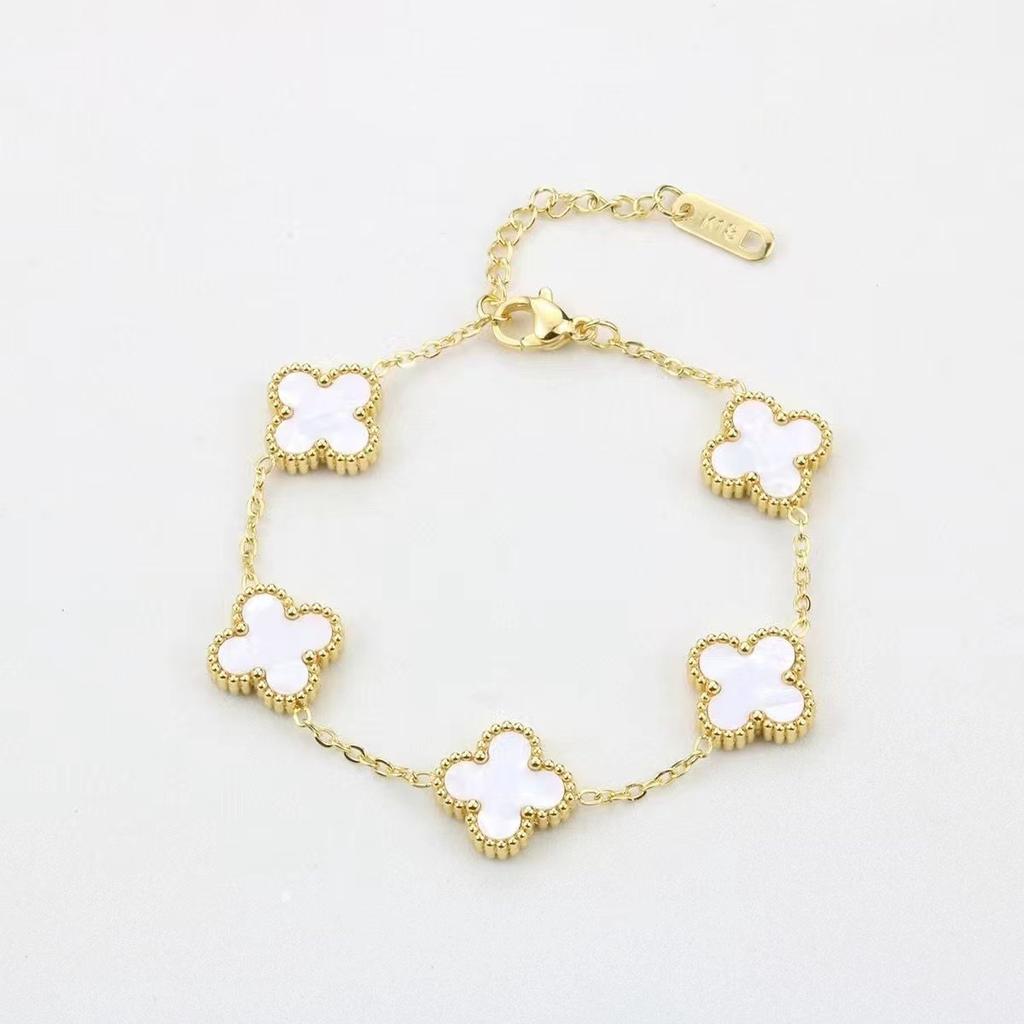 Bracciale da donna a fascia con conchiglia double-face e quadrifoglio, resistente ai colori, alla moda e di alta gamma