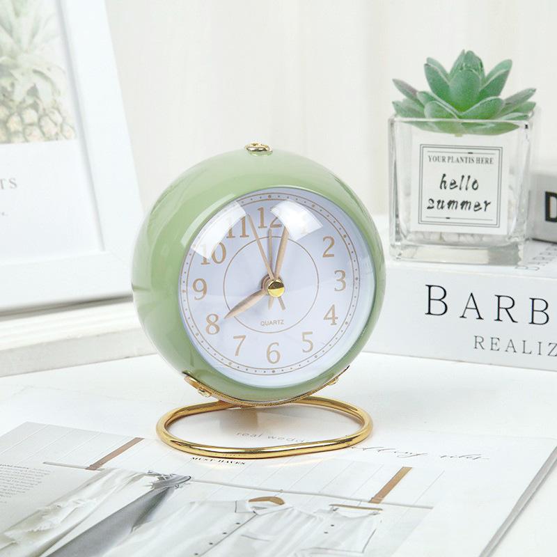 Silent Metal Alarm Clock with Night Light and Gold Stamped Spherical Face - Perfect for Students and Children.