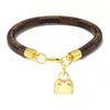 High-End Fashion Stripe Leather Bracelet with Gold-Plated Metal Accents