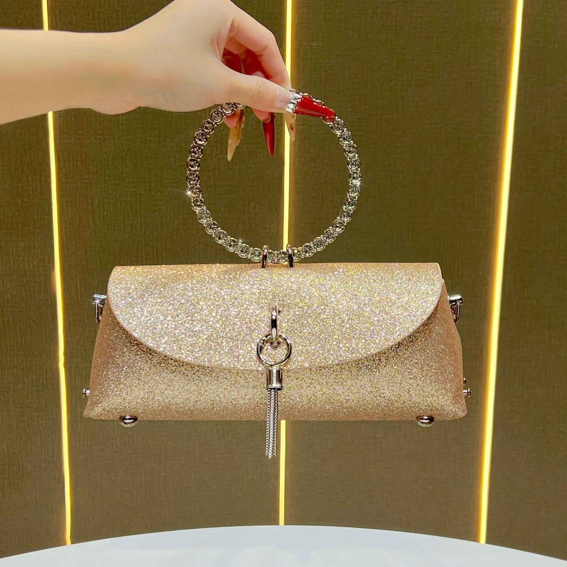 

diamond-encrusted ring handbag bag, textured chain shoulder bag, fashionable and shiny messenger bag, fringed premium handbag.