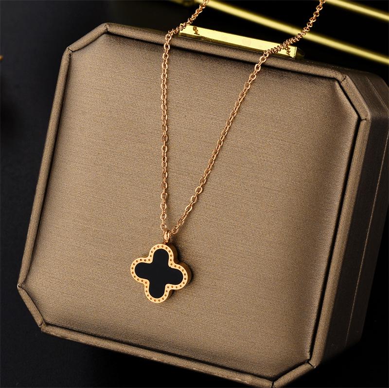 

Классический браслет из титановой стали с реверсивным черно-белым четырехлистным клевером и кольцо из розового золота 18 карат - женские украшения ручной работы