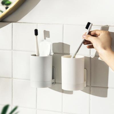 Plastový nástěnný kelímek na zubní kartáček Nástěnný užitečný lepkavý držák na zubní pastu