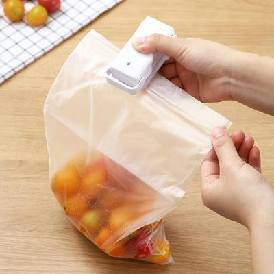 Barevný přenosný ruční domácí elektronický mini tepelný utěsňovací stroj Plastové potraviny Svačiny Bag Packing Sealer Tool