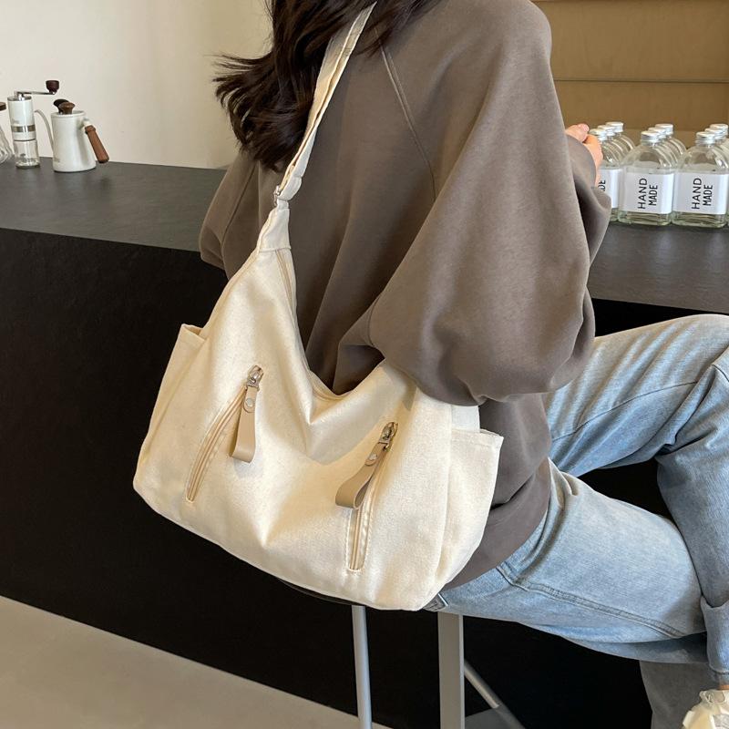 Shoulder bag women's large capacity 2025 new solid color versatile Korean version casual large capacity messenger bag canvas dumpling bag